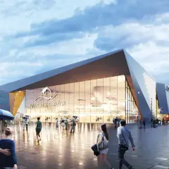 Nowoczesny budynek oceanarium Gdańsk z napisem "Nautilus Gdańsk" i logo delfina. Ludzie spacerują po placu przed budynkiem.